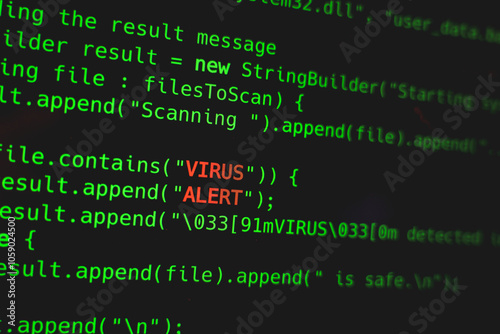 Green code line with Virus Alert words on screen. Security online concept