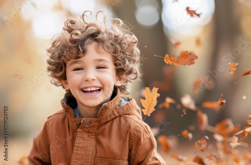 Boy Laughing in Falling Autumn Leaves