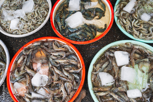 piles of fresh shrimp, ready for sale in the traditional market of Nha Trang, Vietnam photo