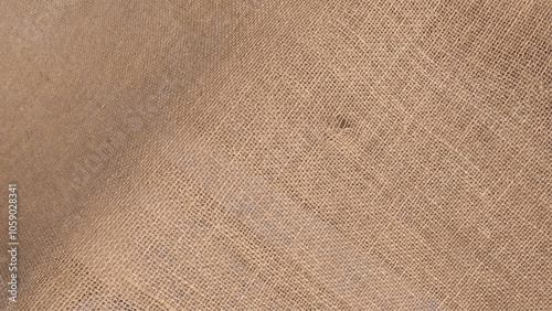 Natural hessian beige textile texture. Linen fabric backdrop. Rough burlap texture, canvas coarse cloth, dark brown woven rustic bagging. 