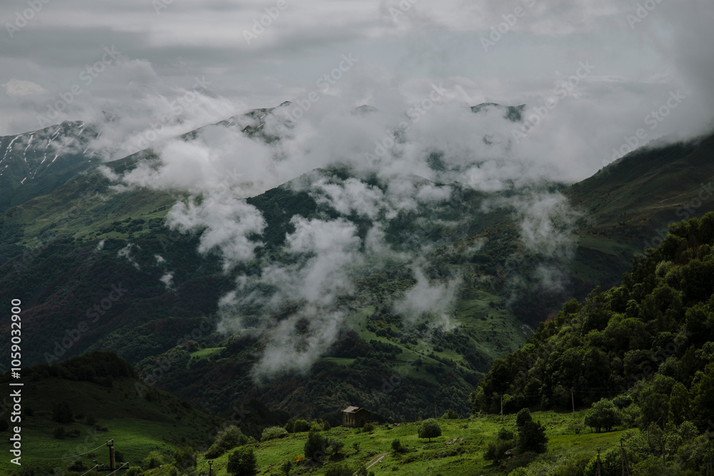 Serene Mountain Landscape with Rolling Green Hills and Foggy Skies Serene Mountain Landscape with Rolling Green Hills and Foggy Skies