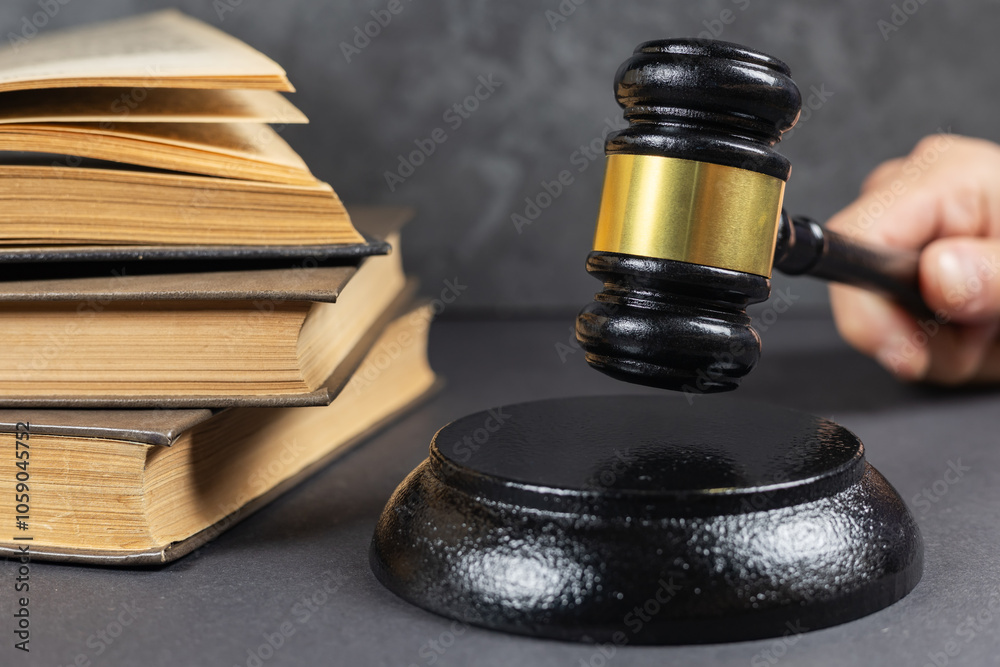 Law theme, lawyer's desk. Judge gavel on legal books Law theme, lawyer's desk. Judge gavel on legal books