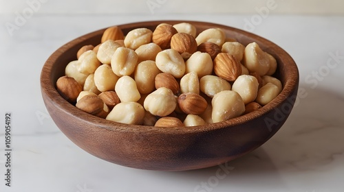 Mixed macadamia nuts in rustic wooden bowl, top view food photography on white marble table, organic healthy snacks styling with natural brown tones.