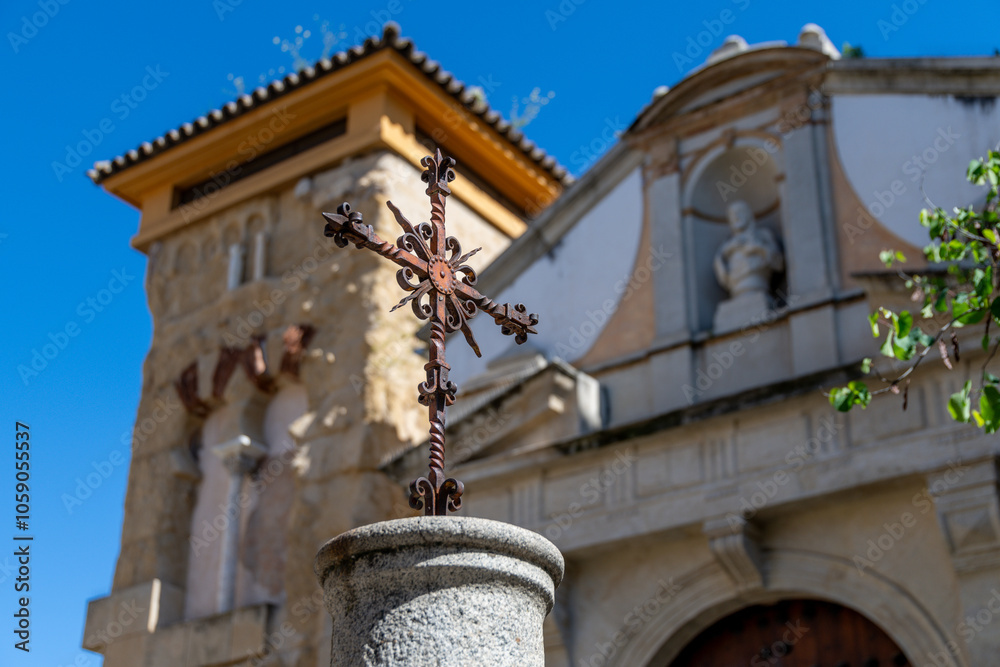 Fototapeta premium Iron Cross in Front of Historic Chapel in Cordoba, Spain
