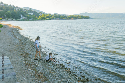 Children playing on shore of Doirani lake. photo