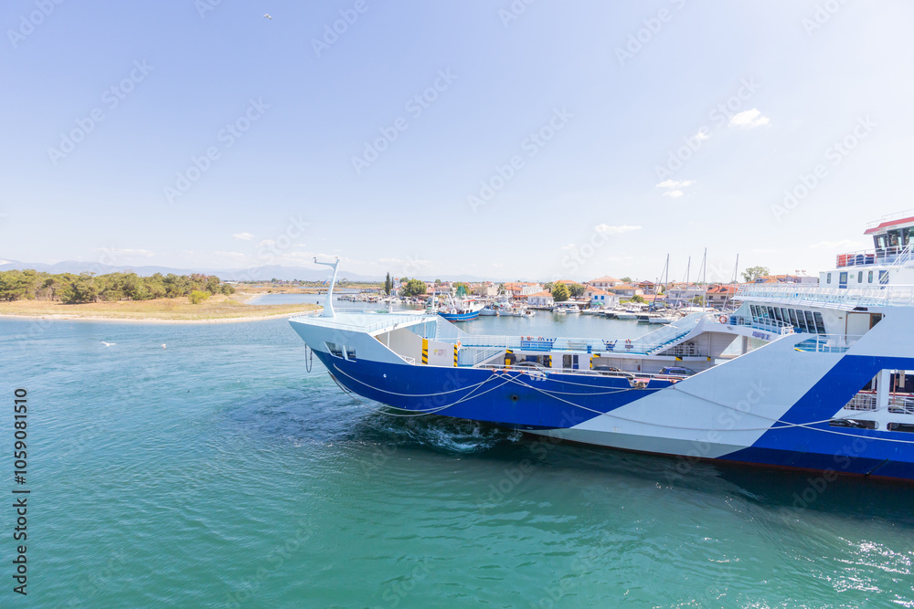 Ferry Arriving at Keramoti Harbor, Greece on a Sunny Day Ferry Arriving at Keramoti Harbor, Greece on a Sunny Day