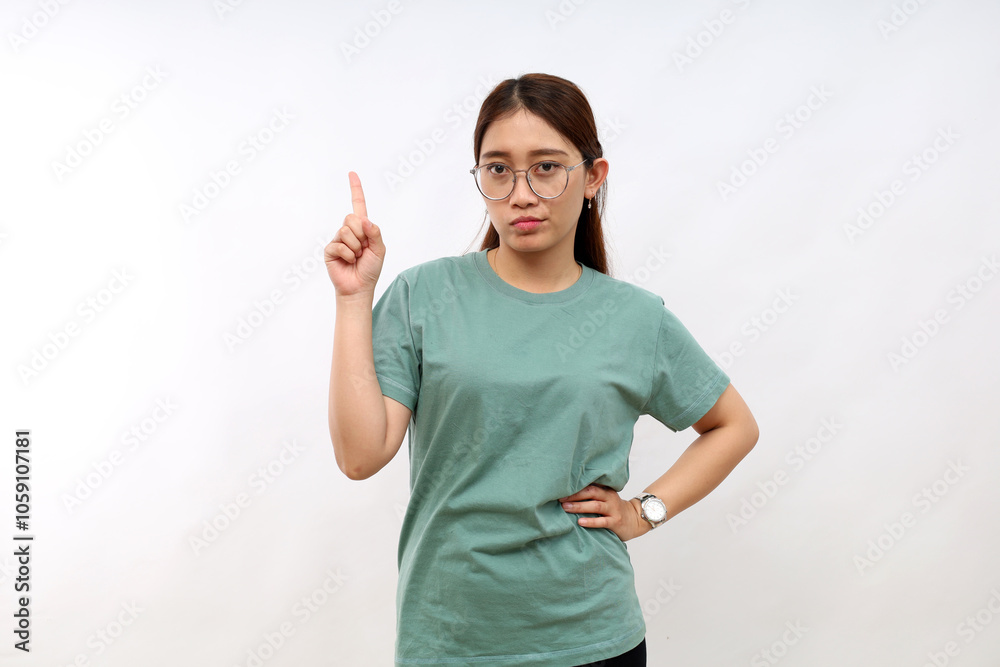 Serious angry young asian woman making restriction, give warning sign. Displeased woman showing stop, shaking finger as scolding someone, forbid action, isolated on white background Serious angry young asian woman making restriction, give warning sign. Displeased woman showing stop, shaking finger as scolding someone, forbid action, isolated on white background