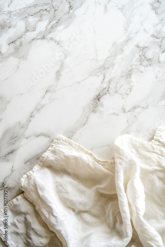 Vertical Overhead Shot of a White Linen Napkin on a White Marble Kitchen Counter with Room for Text.