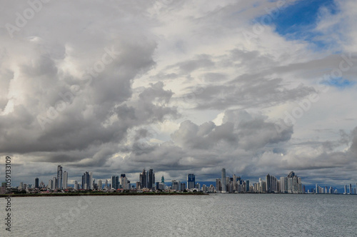 Panama City skyline with clouds reflected on tranquil waters