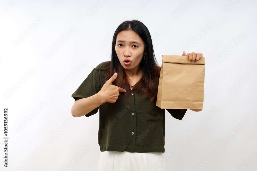 Asian woman looking shocked and surprised with mouth wide open, pointing to self. take away concept Asian woman looking shocked and surprised with mouth wide open, pointing to self. take away concept