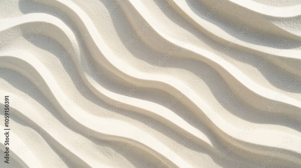 Relaxing wave patterns on beach sand, perfect background capturing a calm summer atmosphere.