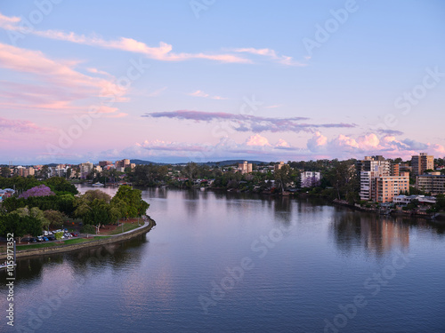 Pink sky reflected on water of the Brisbane River photo