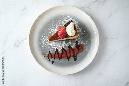 Overhead shot of strawberry cheesecake slice on plate