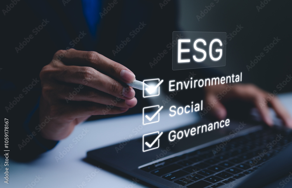 Naklejka premium ESG Concept for Environmental, Social, and Governance. Businessman checking off ESG factors Environmental, Social, Governance on virtual screen, sustainable business practices. strategy investing, CSR
