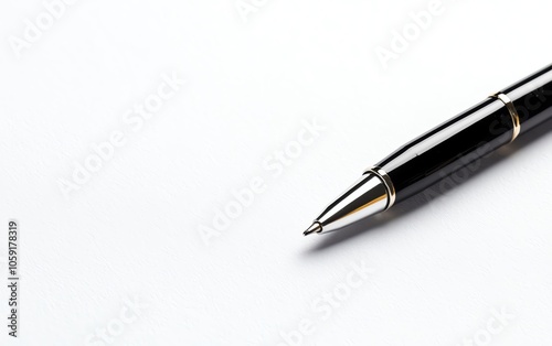 Close-up of a black pen on a white isolated background.