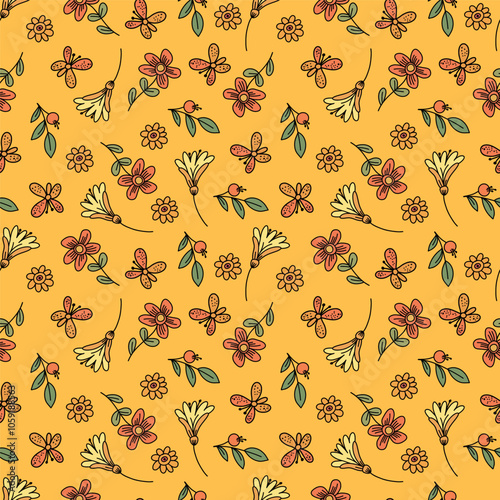 A pattern of small flowers and leaves. Seamless fabric background with a bohemian pattern in the form of small flowers.