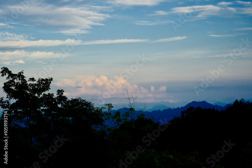 A nice view of blue sky mountains and clouds
