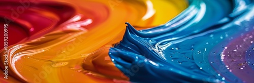Closeup of Vibrant Swirls of Blue, Red, and Yellow Paint