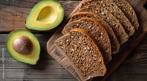 Sliced Rye Bread With Avocado and Spinach on Rustic Wooden Background