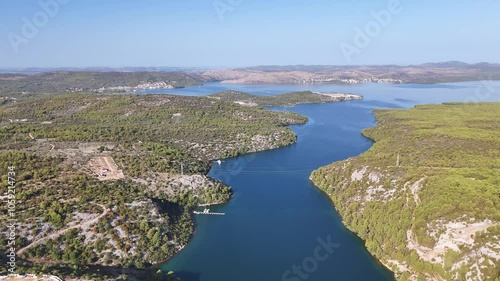 River Krka flows into the Prokljan Lake. Aerial view of the bridge across the river, the higway and viewpoint on the edge of the cliff photo