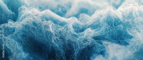 Waves crashing and swirling in deep blue water at twilight near a rocky shore...