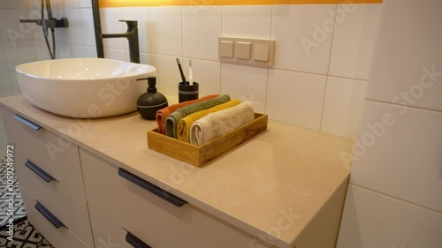 Bathroom interior with sink, toothbrushes and towels