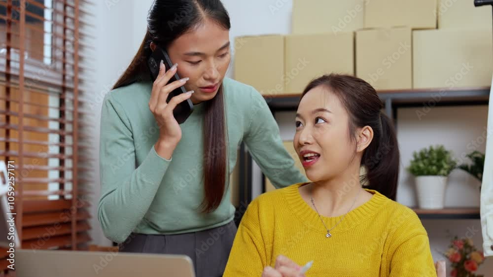Young Entrepreneurs Managing Online Fashion Store from Home Office Using Laptop and Tablet for Marketing and Logistics Young Entrepreneurs Managing Online Fashion Store from Home Office Using Laptop and Tablet for Marketing and Logistics