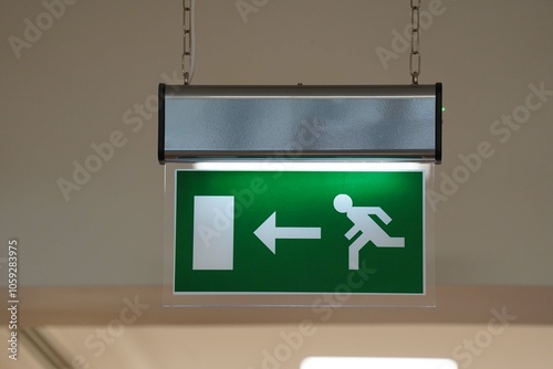 Emergency exit sign. Man running out fire exit