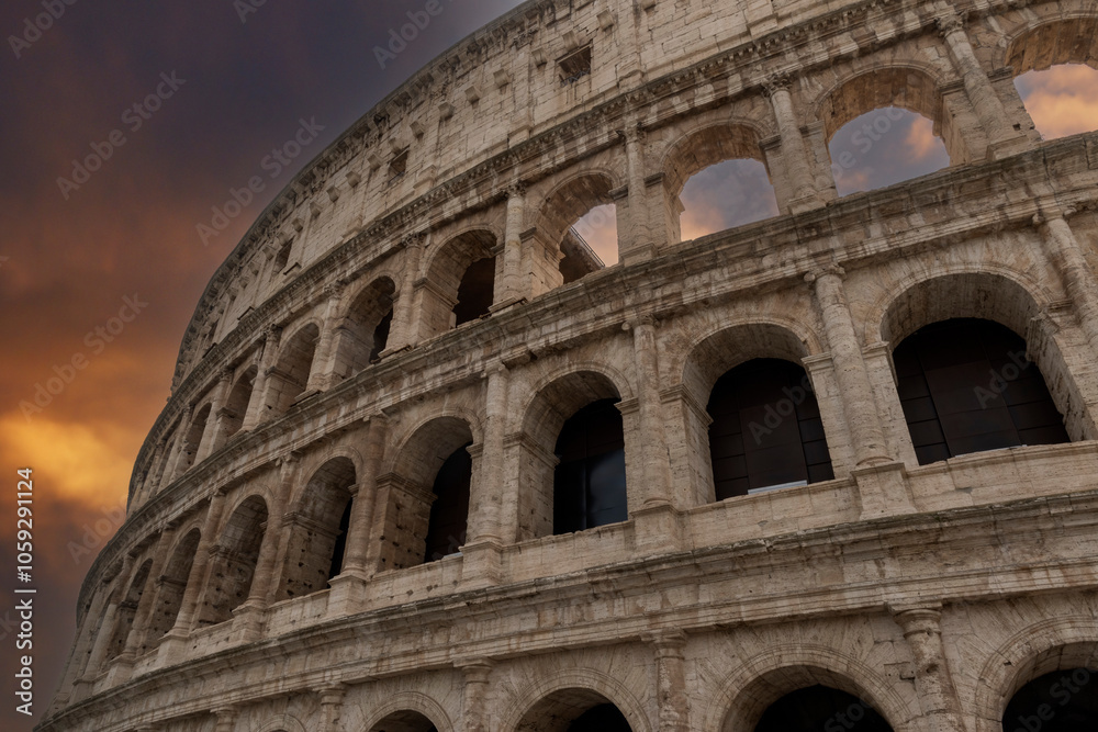 Fototapeta premium Colosseum amphitheatre under a moody sky in Rome