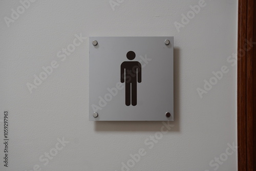 modern public toilet sign on the cement wall