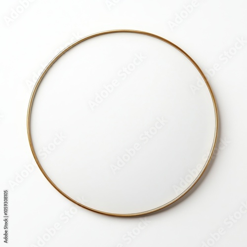 A circular decorative mirror with a textured golden rim, set against a plain background, exuding elegance and minimalism.