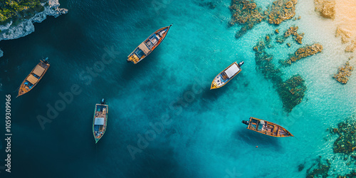 Aerial View of Boats on Clear Blue Water Near Rocky Coast