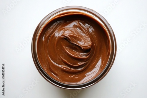 Hazelnut cocoa cream on pale background, aerial perspective photo