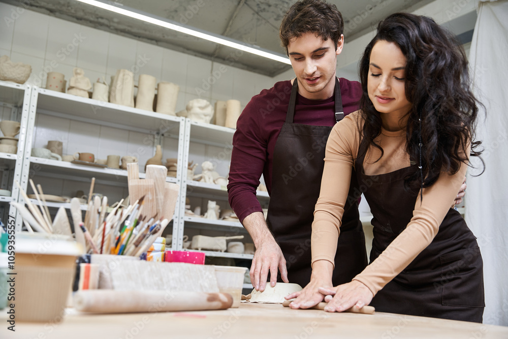 A couple crafts pottery with joy and creativity in their studio.