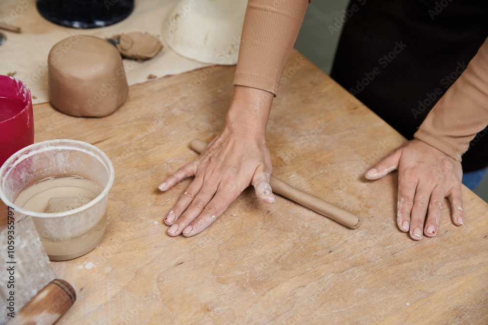 Talented young woman with apron making pottery. Talented young woman with apron making pottery.