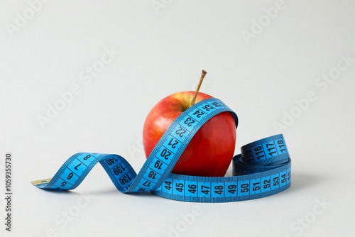 Diet and weight loss, healthy lifestyle, composition with measuring tape photo