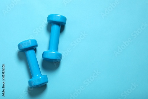 Sport equipment on color background, top view