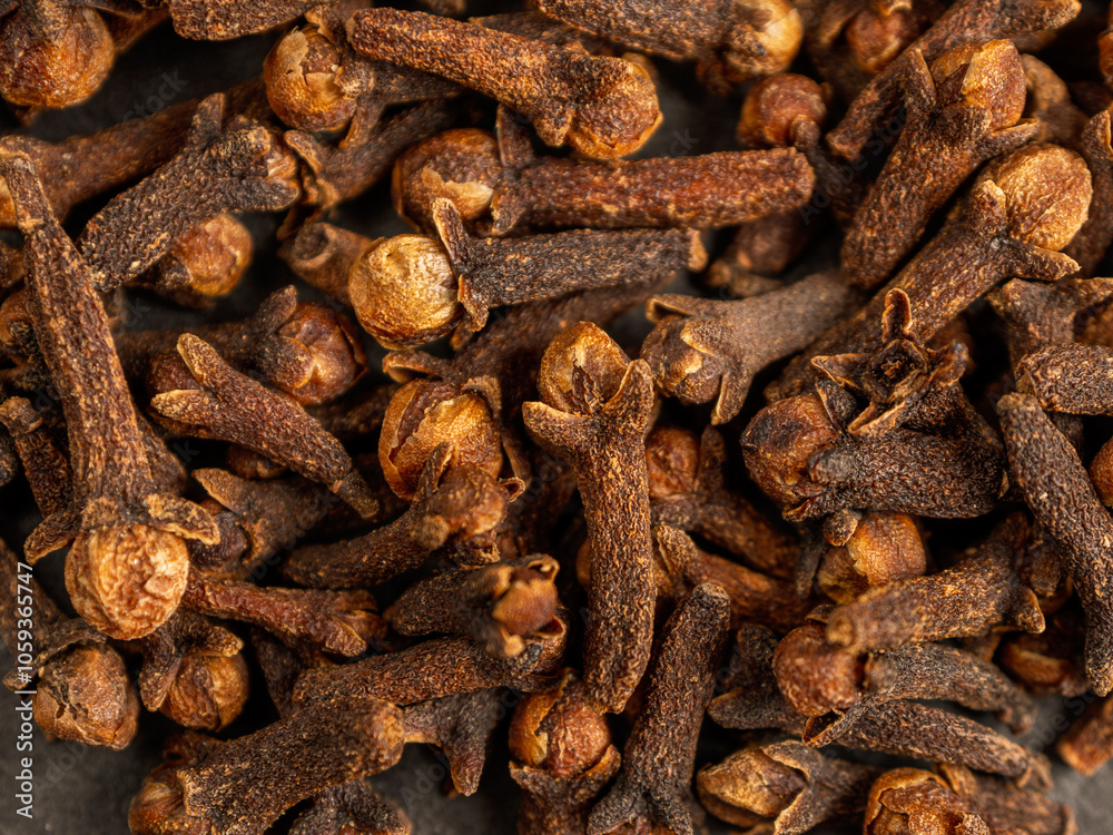 A close-up of aromatic cloves, highlighting the texture and rich color A close-up of aromatic cloves, highlighting the texture and rich color