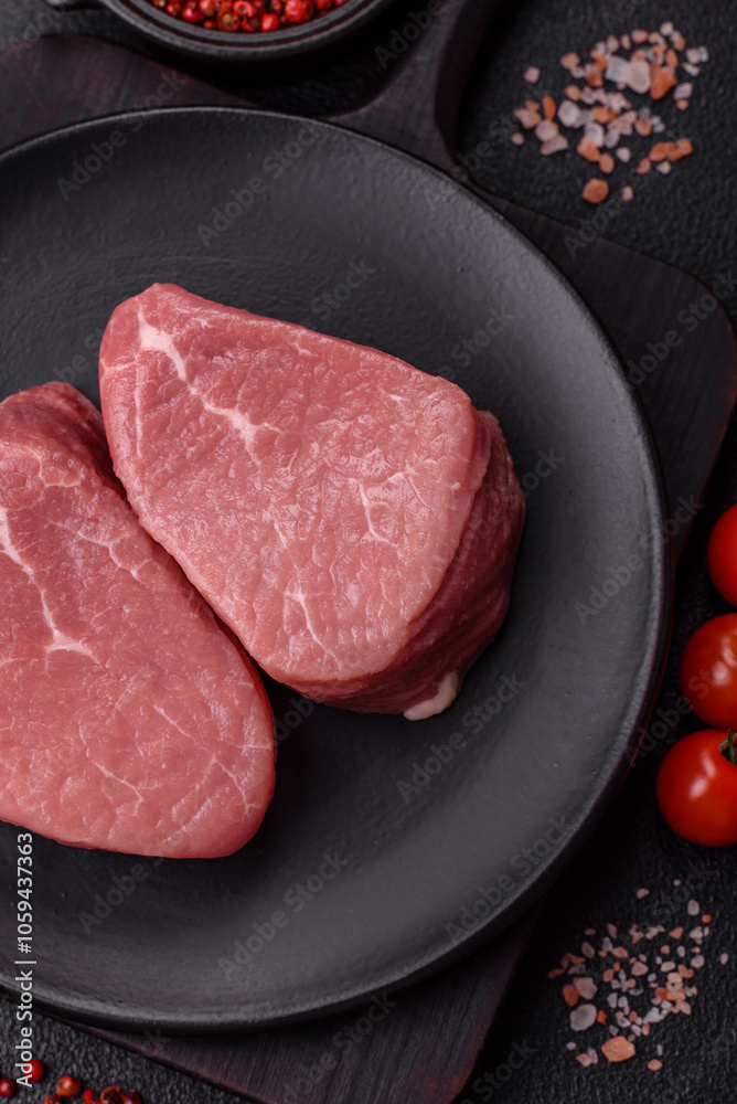 Ribeye steak raw with salt, spices and herbs Ribeye steak raw with salt, spices and herbs