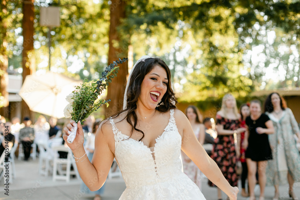 Beautiful Bride Gets Ready to Toss the Bouquet to Wedding Guests Beautiful Bride Gets Ready to Toss the Bouquet to Wedding Guests