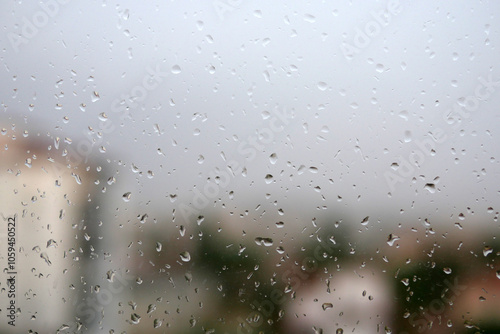 Obraz na płótnie Raindrops falling on the balcony glass, raindrops sliding off the glass, w salonie