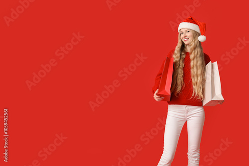 Young happy woman in Santa ...