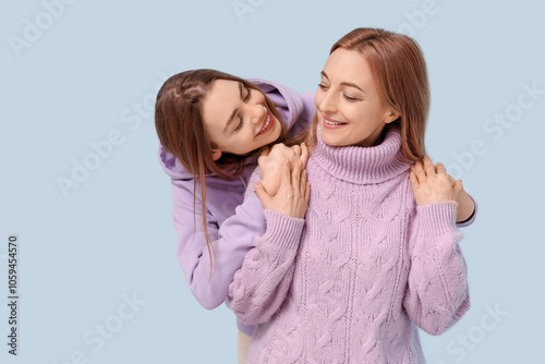 Happy young woman hugging h...