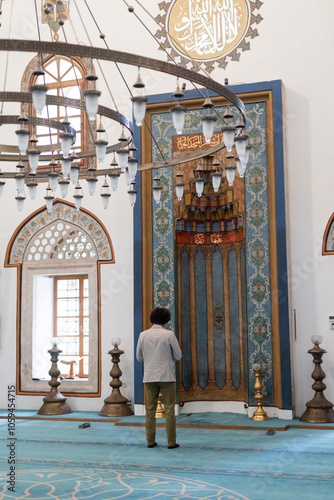 man praying salah inside the Emperor's Mosque photo