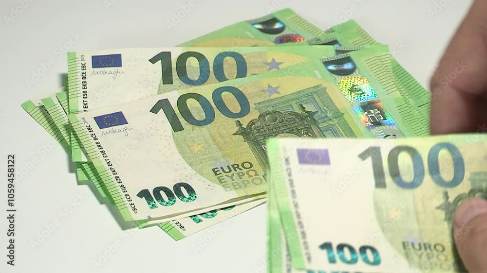 Leaf through 100 EURO banknotes on table Leaf through 100 EURO banknotes on table