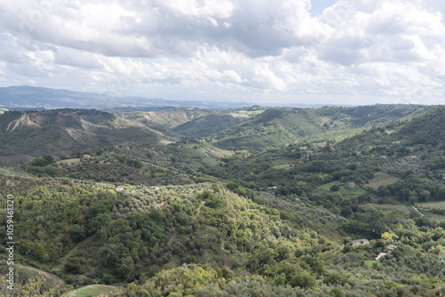 Bagnoregio, Italy - September 28: Panoramic View from Civita di Bagnoregio Overlooking the Valle dei Calanchi valley. Typical Scenic Hills and Rolling Landscapes. Italian autumn day.