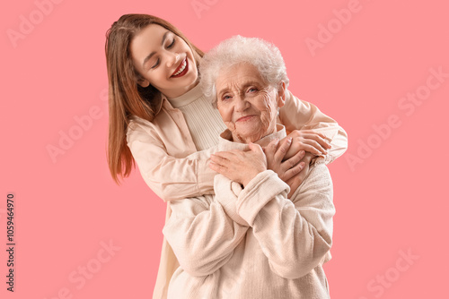 Young woman hugging her gra...
