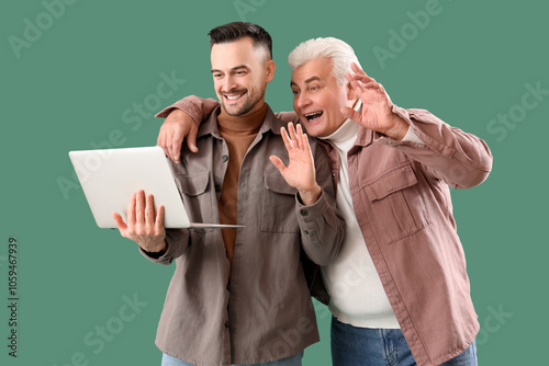 Mature man with his son vid...