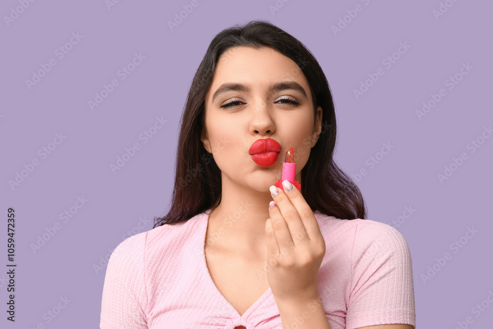 Beautiful young woman with lipstick on lilac background Beautiful young woman with lipstick on lilac background