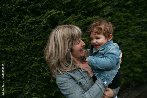 Close-up of smiling woman and child photo